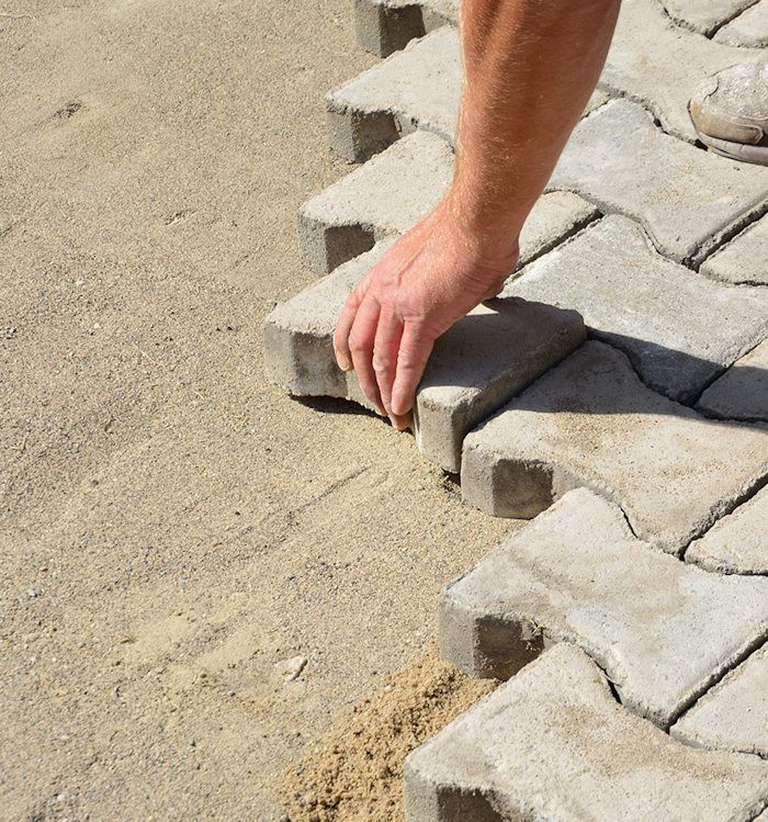 Beautiful brick paver driveway installation with elegant design patterns